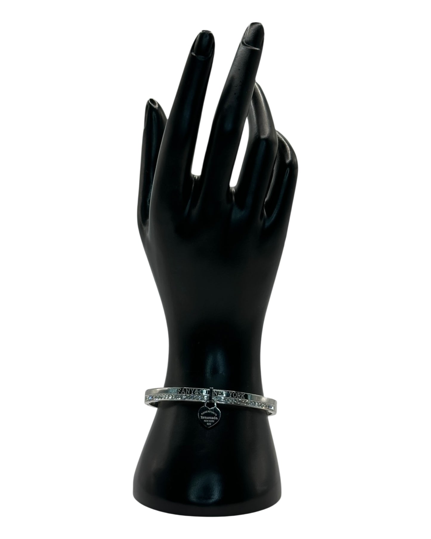 Tiffany & Co. Armreif mit Zirkonia & Herz-Anhänger, Silber