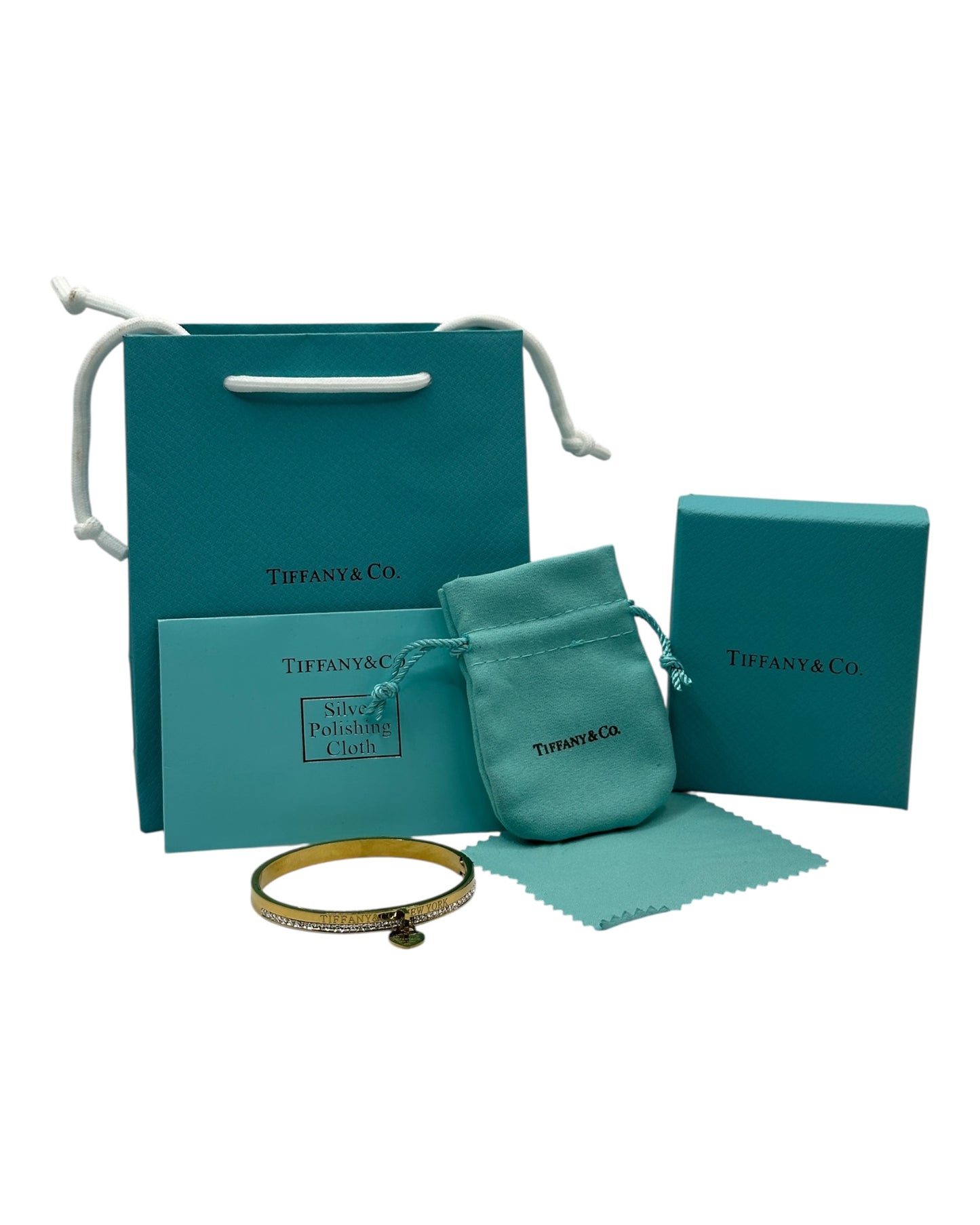 Tiffany & Co. Armreif mit Zirkonia & Herz-Anhänger, Gold