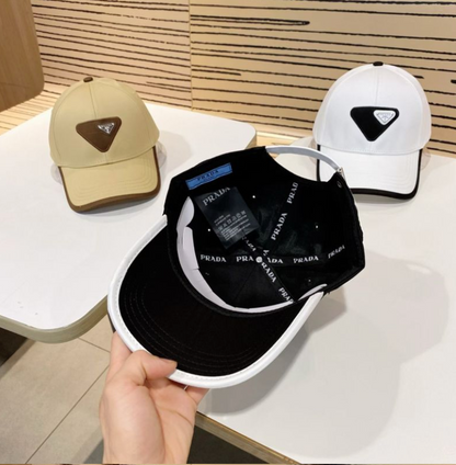 PRADA MACRO TRIANGLE PATCH BASEBALL CAP – BEIGE / WHITE / BLACK – HIGH END
