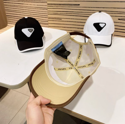 PRADA MACRO TRIANGLE PATCH BASEBALL CAP – BEIGE / WHITE / BLACK – HIGH END