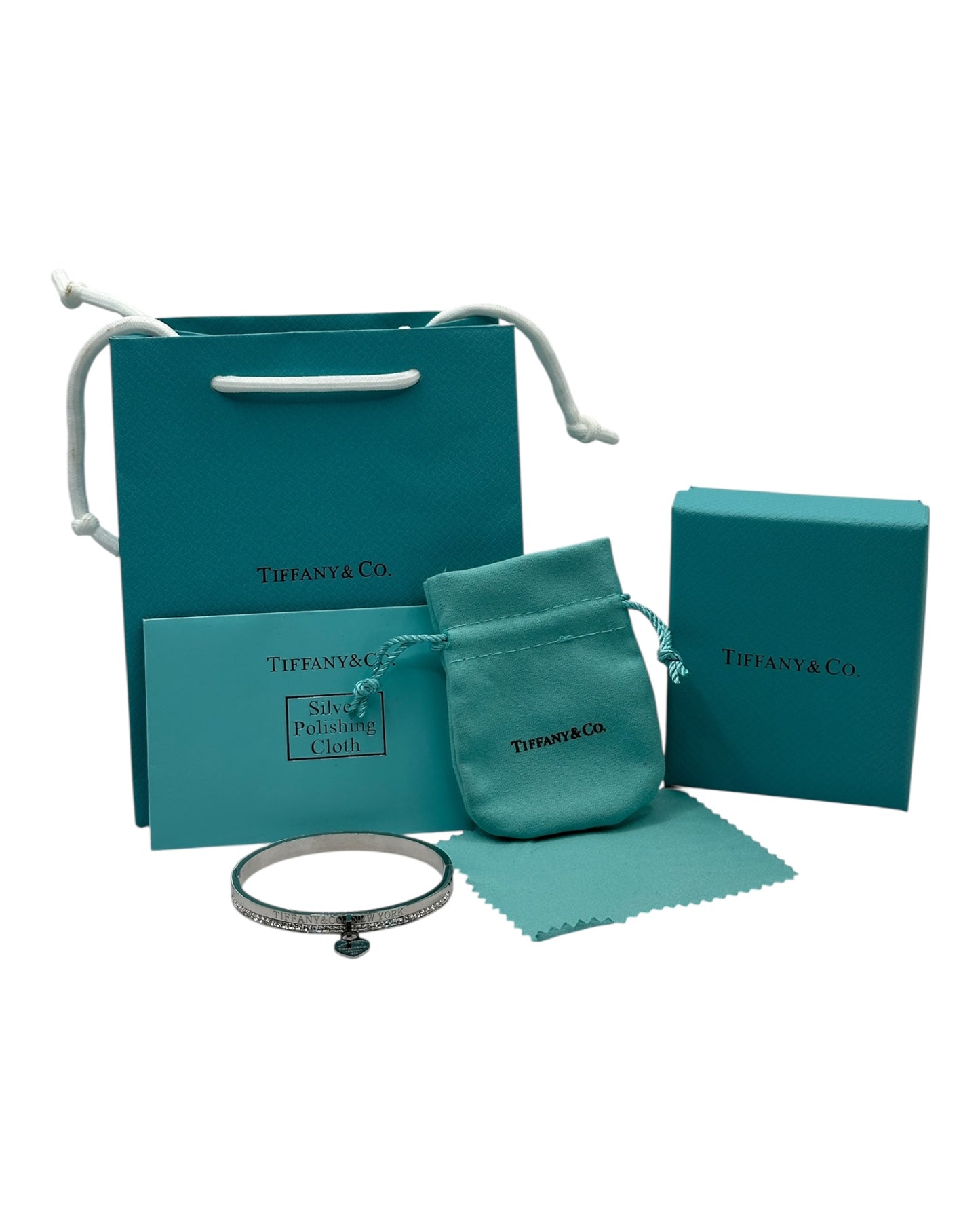Tiffany & Co. Armreif mit Zirkonia & Herz-Anhänger, Silber