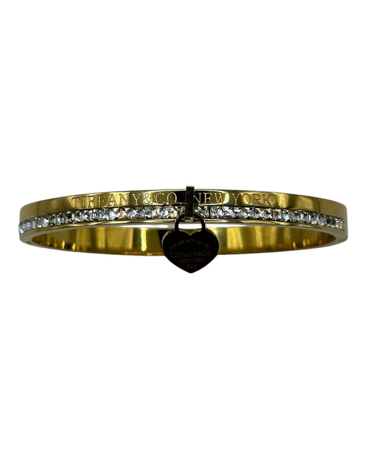 Tiffany & Co. Armreif mit Zirkonia & Herz-Anhänger, Gold