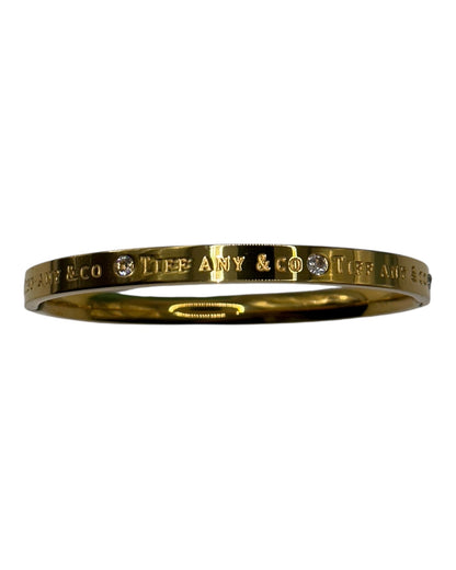 Tiffany & Co. Klassisches Armband mit Logogravur in Gold